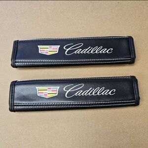 2 new Cadillac seat belt pads